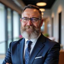 Man wearing a suit smiling