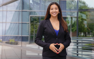 woman smiling in blazer outside