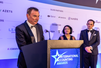 Lee White recieving outstanding achievement award June 2026