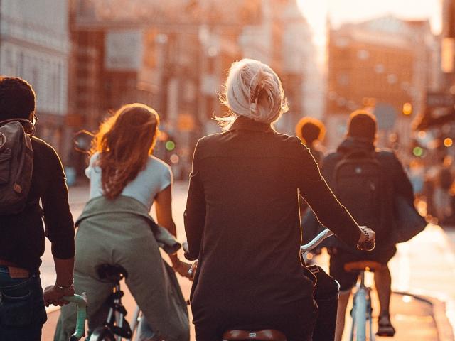 copenhagen group of cyclists at sunset