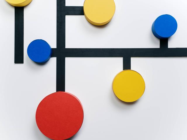Six colored circles connected by thick black lines