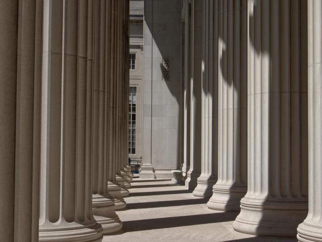 A row of large white columns outside