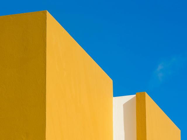 Two yellow blocks against a blue background