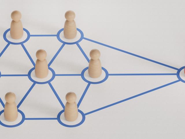 A group of figures all connected to one figure