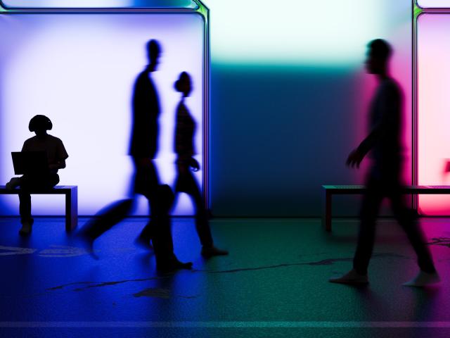 Silhouettes in front of a patchwork neon backdrop