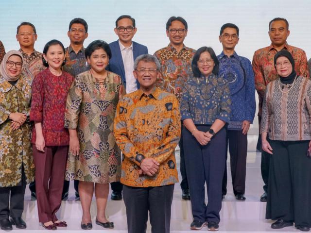IAI Staff standing onstage at a conference