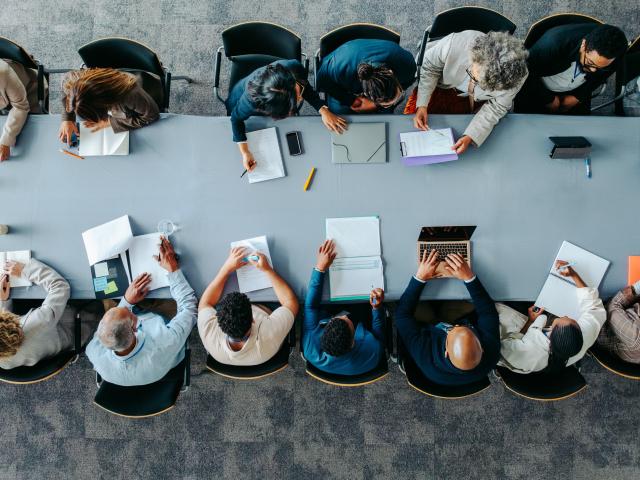 Top view of diverse business group in office meeting