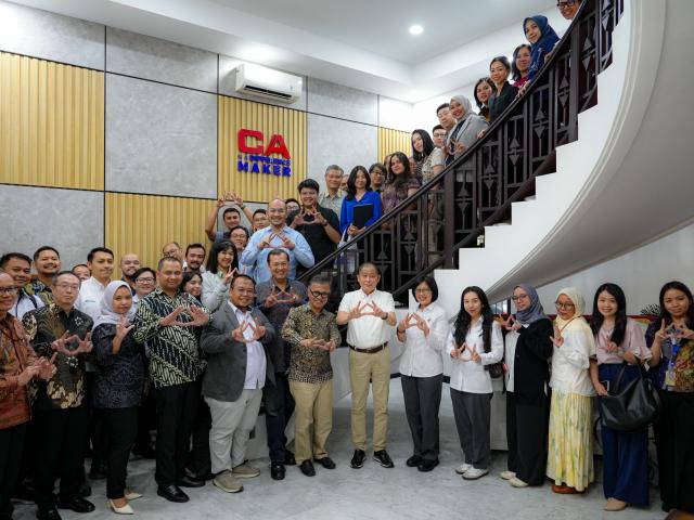 The April 2026 meeting of the Indonesia Sustainability Reporting Forum, with attendees standing on a staircase