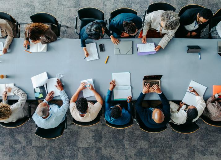 Top view of diverse business group in office meeting