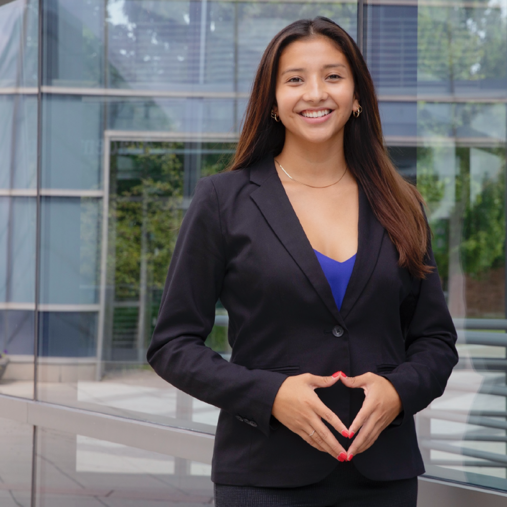 woman smiling in blazer outside