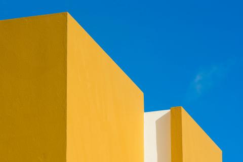 Two yellow blocks against a blue background