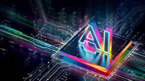 A computer chip lit with neon colors with "AI" in 3D letter on top of it