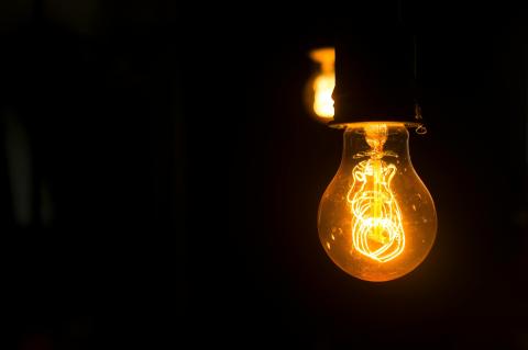 A lightbulb in a dark room