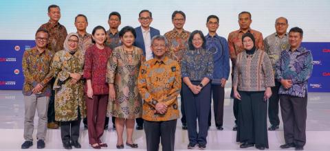 IAI Staff standing onstage at a conference