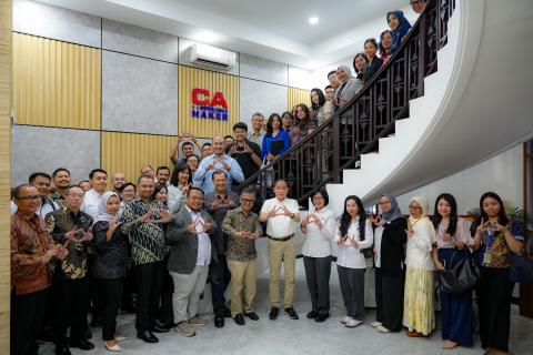 The April 2026 meeting of the Indonesia Sustainability Reporting Forum, with attendees standing on a staircase