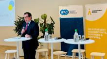 Tom Seidenstein addressing sustainability assurance event crowd