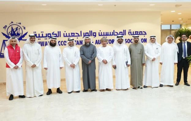 The standing group photo from the IFAC Connect event in Riyadh in 2025. 11 men standing, smiling at the camera in front of the PAO sign
